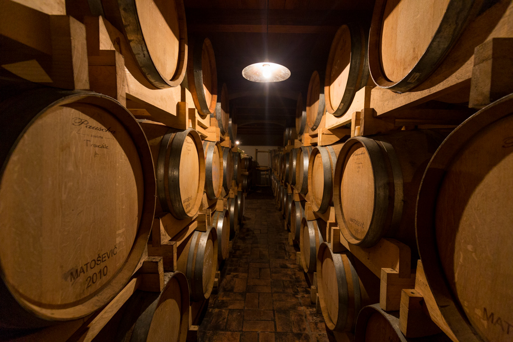 Image of oak barrels in a wine cellar
