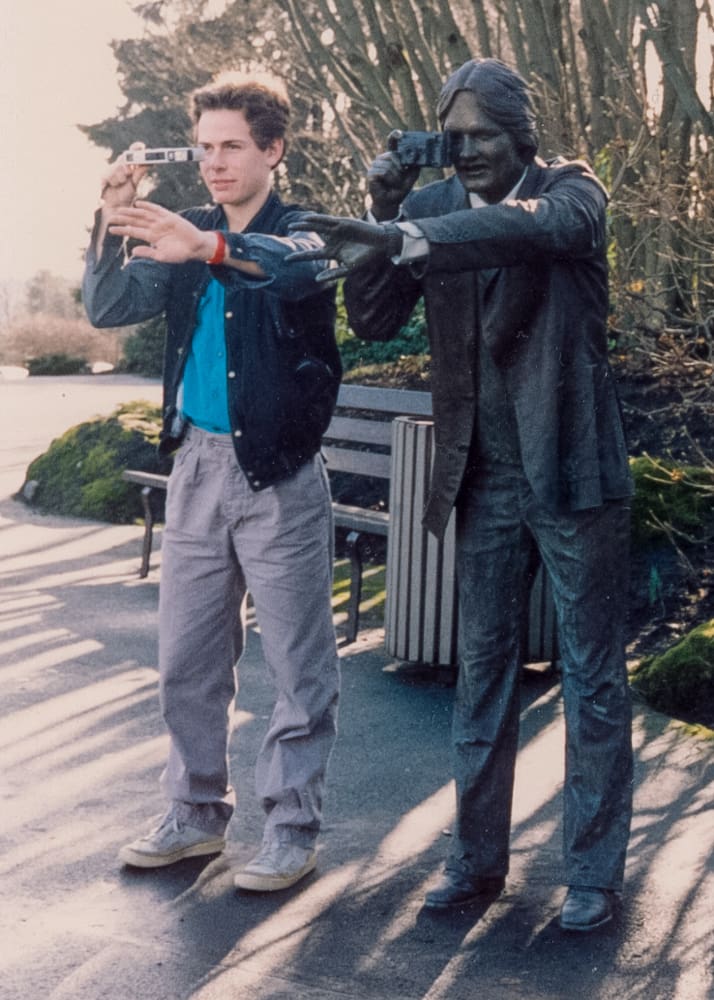 John Greengo in 1986 posing with his Minolta Autopay 460Tx in Vancouver B.C. Canada.