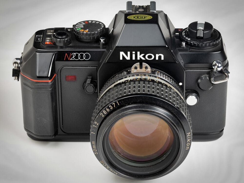 Nikon N2000, a basic camera good for learning, paired with a lens acquired much later in life.