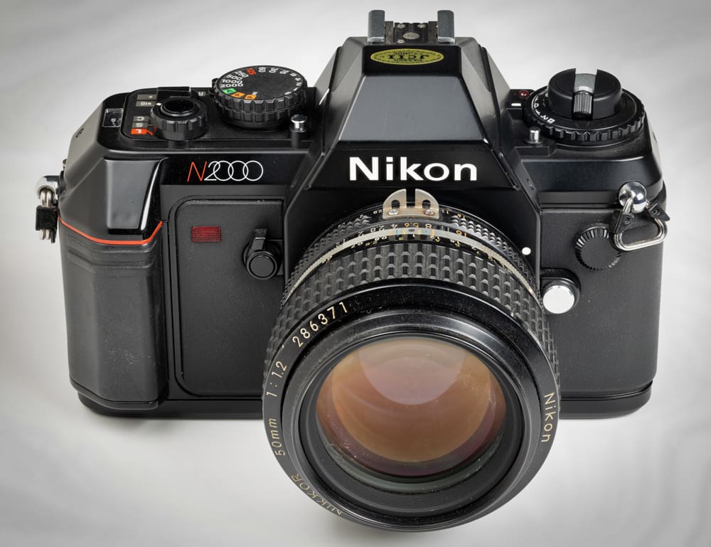 Nikon N2000, a basic camera good for learning, paired with a lens acquired much later in life.