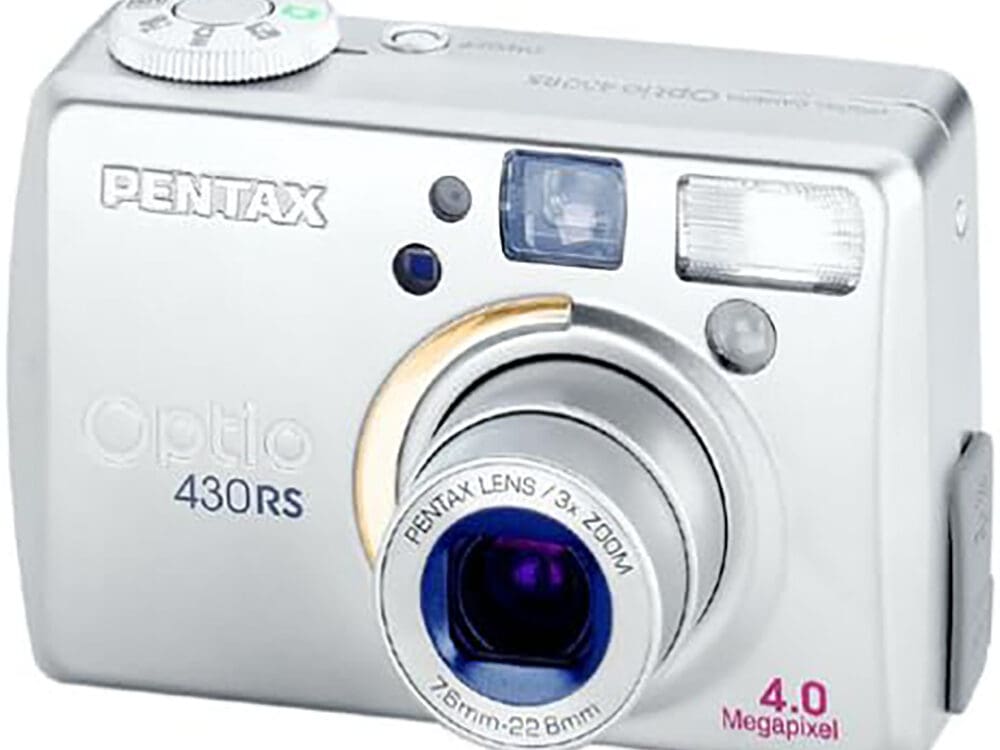 Silver Pentax Optio 430 compact digital camera with a 3x zoom lens.
